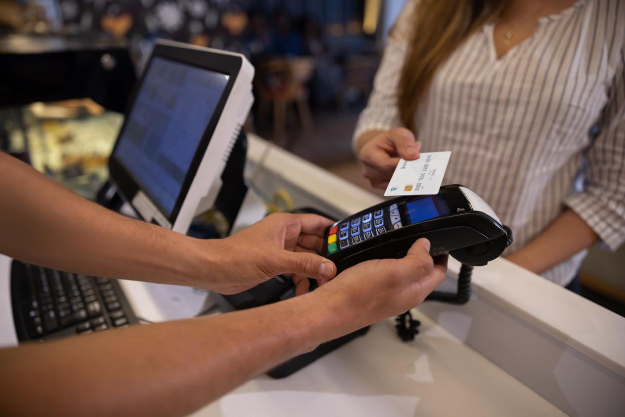 woman making a contactless payment