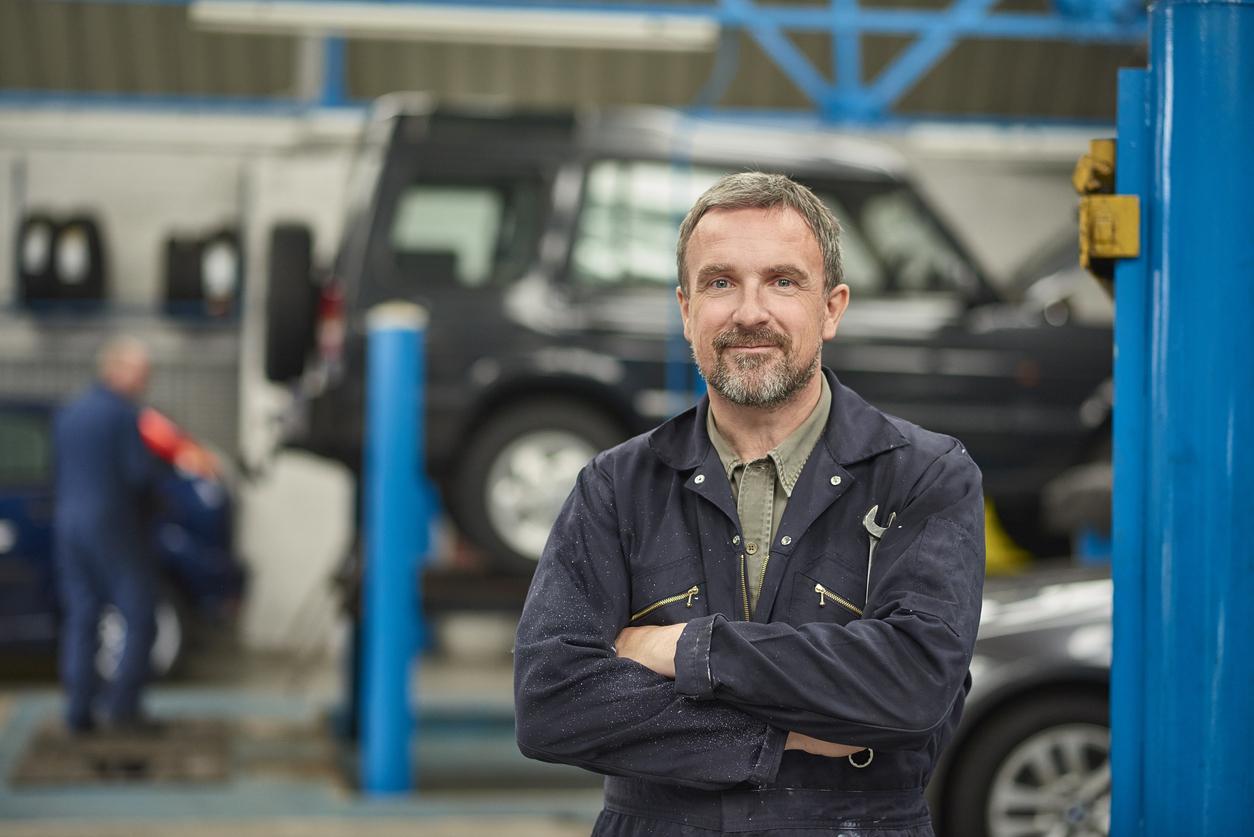 smiling garage owner
