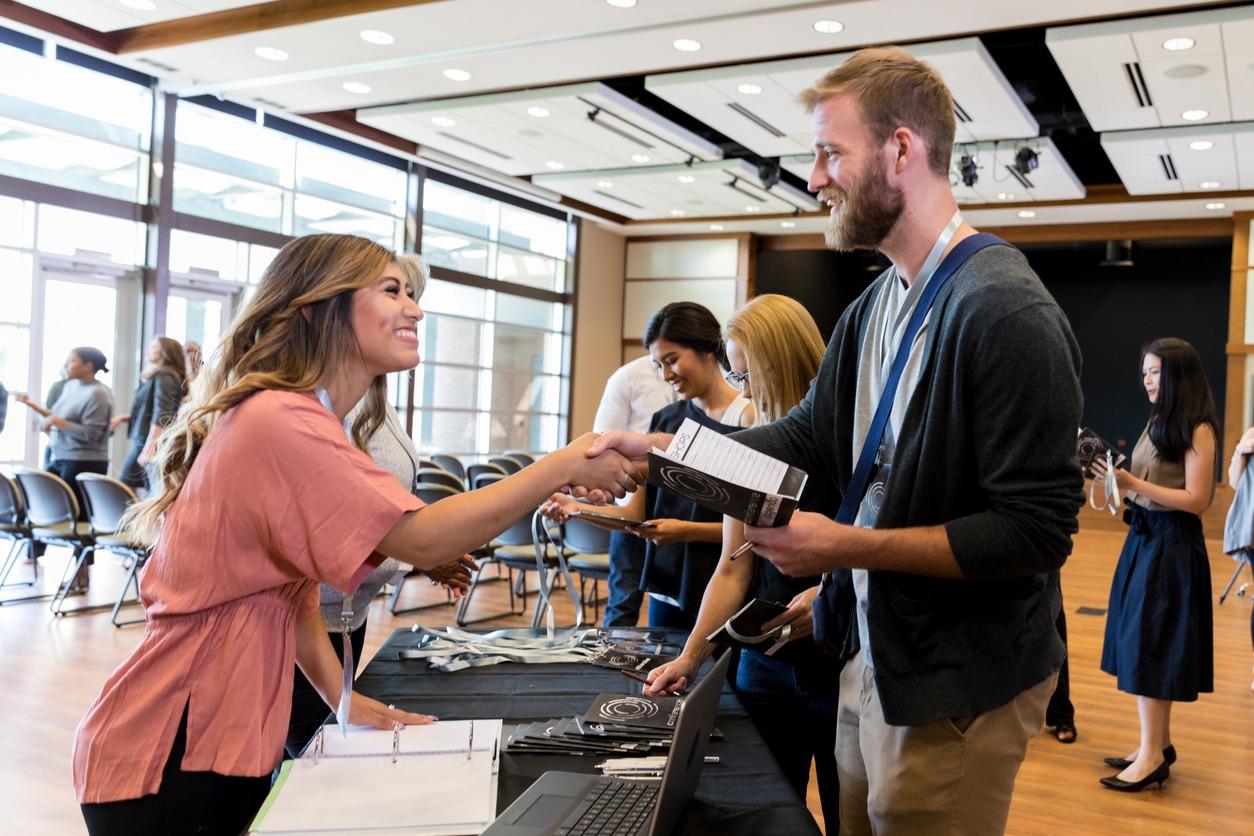 Woman standing at registration desk